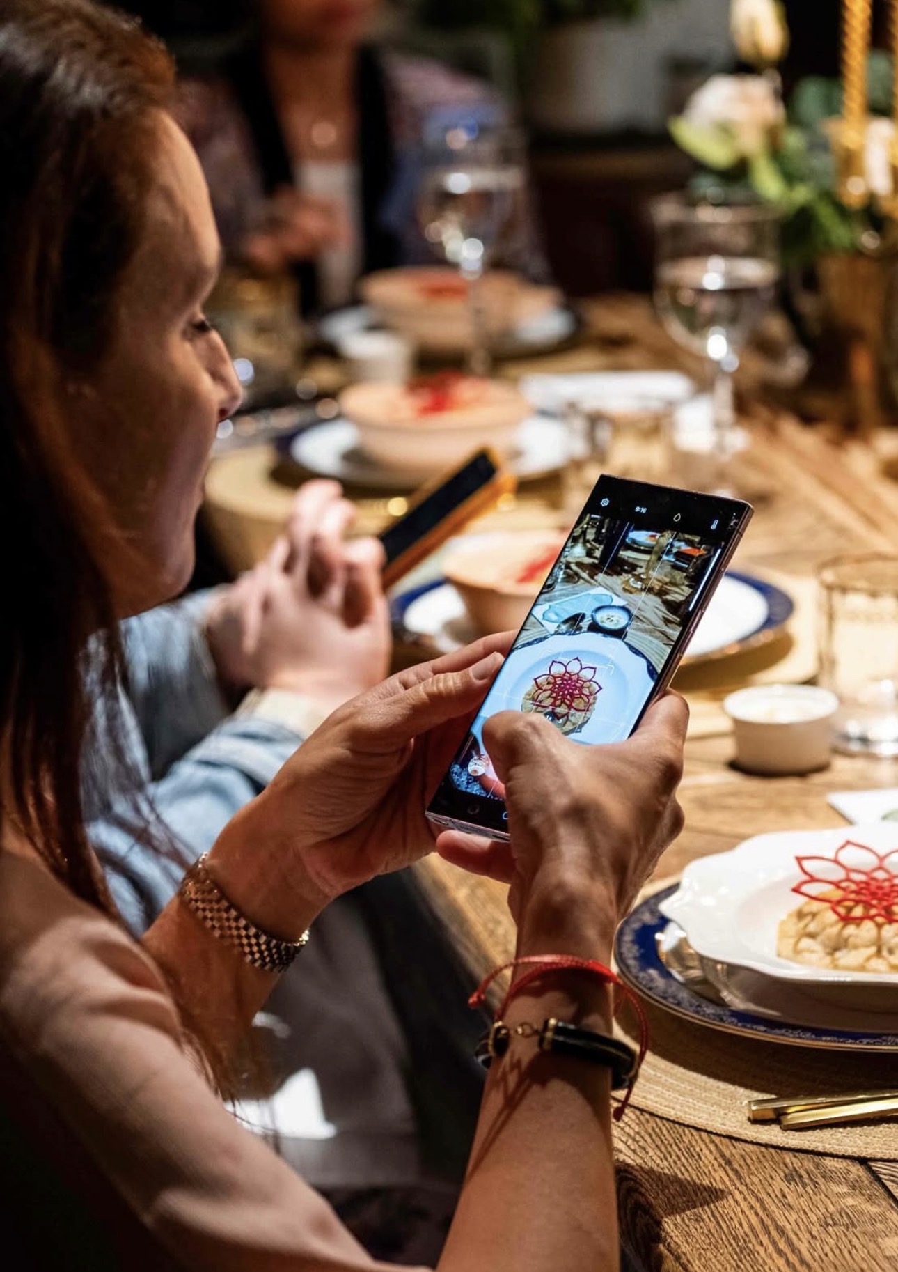 Family gathering around a shared dining table